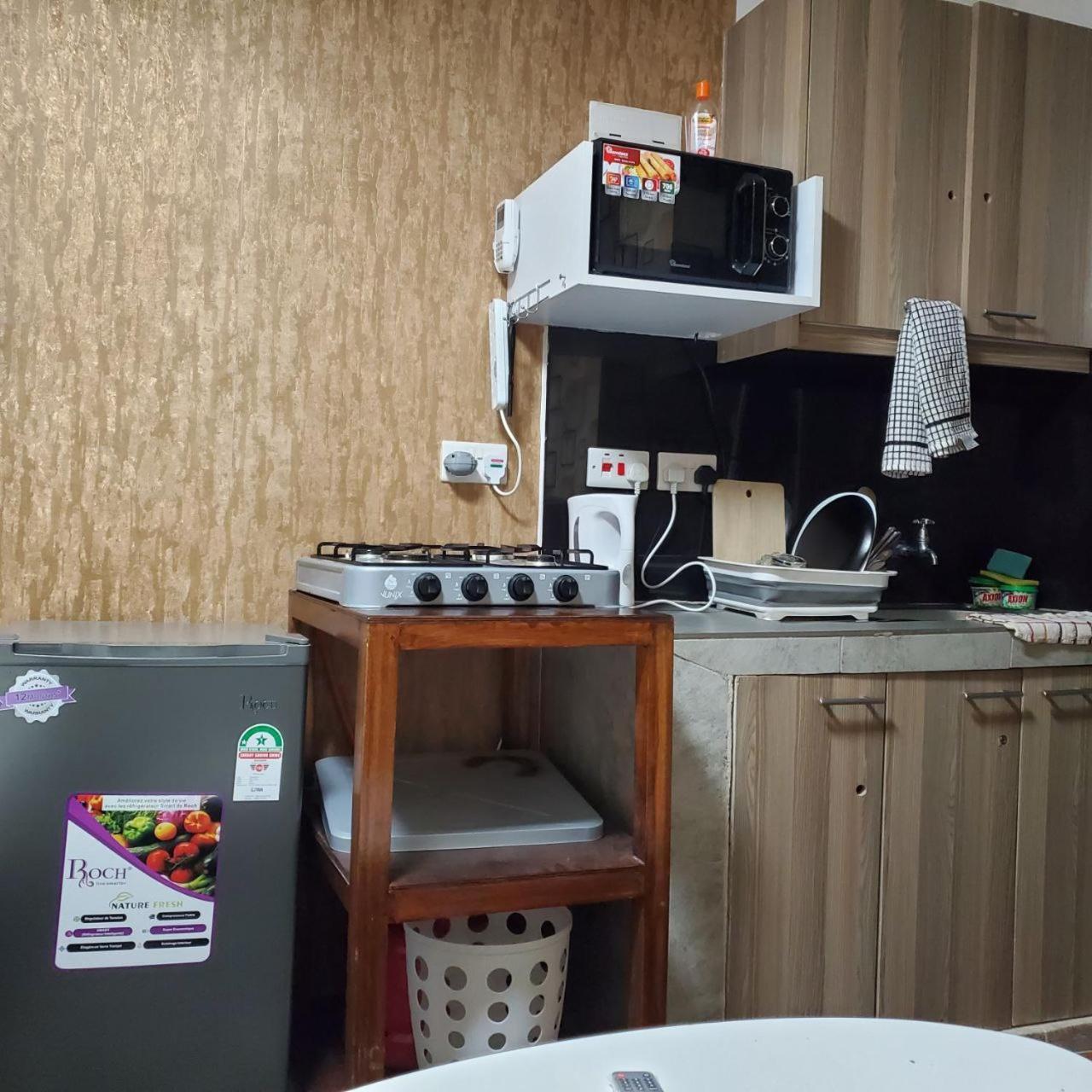 Apartment Lovely & Cozy Compact Studio Near Airport With Rooftop View Nairobi