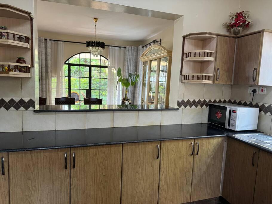 Exquisite 4-bedroom In Prime Gated Community Pousada Nairobi